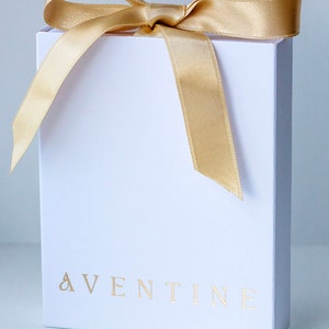 White and gold elegant jewelry gift packaging box with bow
