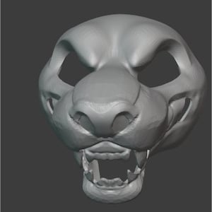 May include: A 3D model of a furry animal head with a snarling expression. The model is made of gray plastic and has a detailed snout, teeth, and eyes.