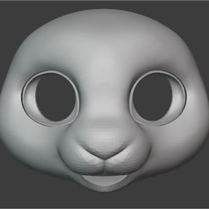 May include: A 3D model of a cartoon bunny face with large eyes, a small nose, and a smiling mouth.