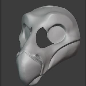 以下が含まれることがあります： くちばしと大きな目の穴のある灰色の3Dプリントされた動物のマスク。マスクは頭に着用するように設計されています。