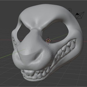 May include: A 3D model of a gray furry mask with a snarling expression. The mask has a large, prominent nose and sharp teeth.