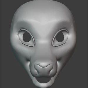 Puede incluir: Un modelo 3D de una cabeza de animal peluda, de color gris claro y con un diseño simple. La cabeza tiene ojos grandes y redondos, una nariz pequeña y una boca ancha.