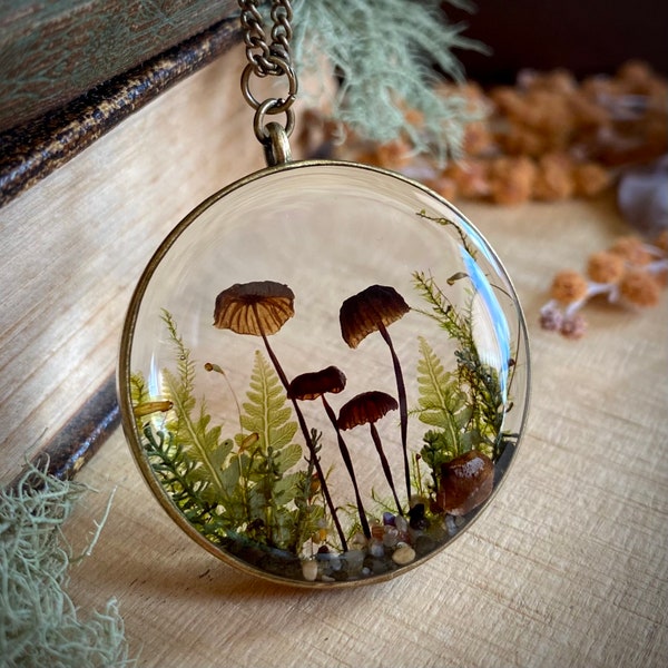 Real mushroom terrarium pendant. Botanical fairy forest necklace made from resin, moss, fern leaves, pebbles & fungi.