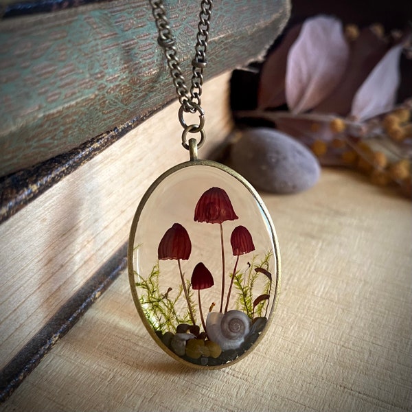 Real mushroom terrarium pendant. Botanical fairy forest necklace made from resin, moss, pebbles & pink fungi.