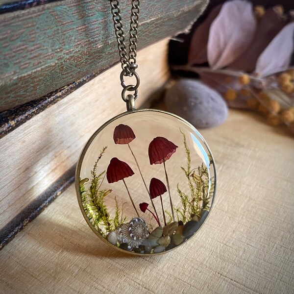 Real pink mushroom terrarium pendant. Botanical fairy forest necklace made from resin, moss, sand, leaves & fungi.