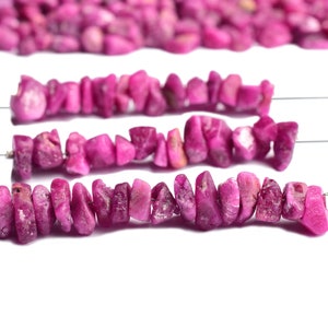 Close-up view of raw ruby showing deep red color and natural texture.