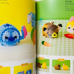 May include: A book with instructions on how to make beaded characters. The book features images of Stitch, Bambi, and Miss Bunny. The characters are made with colourful beads and are approximately 4.8 cm tall.
