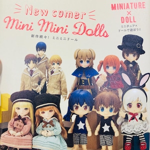 May include: A Dolly*Dolly vol.37 book cover featuring a collection of miniature dolls with diverse outfits, including dresses, jackets, and hats. The text reads New comer Mini Mini Dolls, Miniature x Doll, and Happy Anniversary! Pullip 15th.