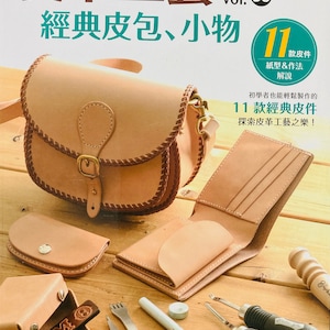 May include: An assortment of leather craft items, including a satchel, wallet, and small accessories. The image features a book titled "Leather Craft Basic Small Articles & Bags" with text in Chinese. Various tools are also displayed, suggesting a DIY leathercraft theme.