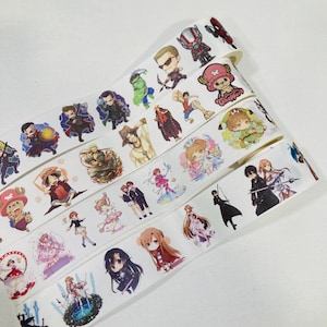May include: A roll of white adhesive tape featuring a repeating pattern of colourful chibi-style anime and comic book characters, including figures like Chopper, Ant-Man, and various sword-wielding warriors, printed in a vibrant, multi-coloured graphic design.