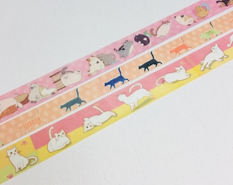 May include: Three rolls of pink, orange, and yellow washi tape with a cat theme. The tape features illustrations of cats in various poses, including sleeping, sitting, and walking.