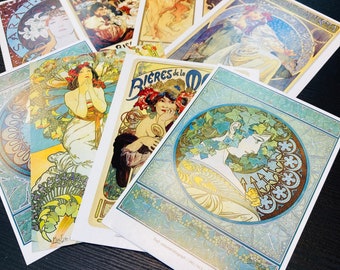 Un conjunto de 30 postales coleccionables de Alphonse Mucha en estilo Art Nouveau con la temática de Diosa, póster y niñas.