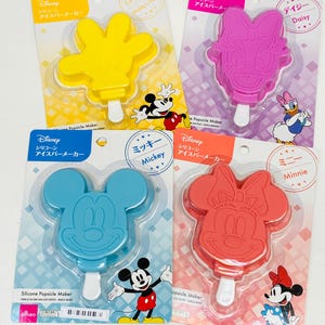 May include: Four silicone popsicle molds featuring Mickey Mouse, Minnie Mouse, Daisy Duck, and Mickey Mouse's hand. The molds are packaged on individual cards with the Disney logo and character names.