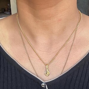 Sacred Ganesha pendant
Indian religious pendant
Cute god charm necklace
Ganesha symbol of success
Small Ganesh locket for kids
Spiritual protection jewelry
Ganesha idol charm
Simple Ganesha pendant
Ganesha gift for spiritual person
Modern Ganesha