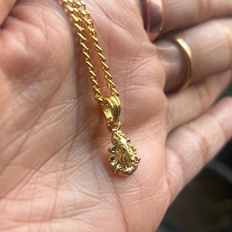Ganpati Bappa pendant
Baby Ganesha charm
Small Hindu god necklace
Elephant god charm
Ganpati kids jewelry
Hindu lucky pendant
Tiny spiritual necklace
Good luck Ganesh locket
Ganesha festival jewelry
Prosperity god pendant