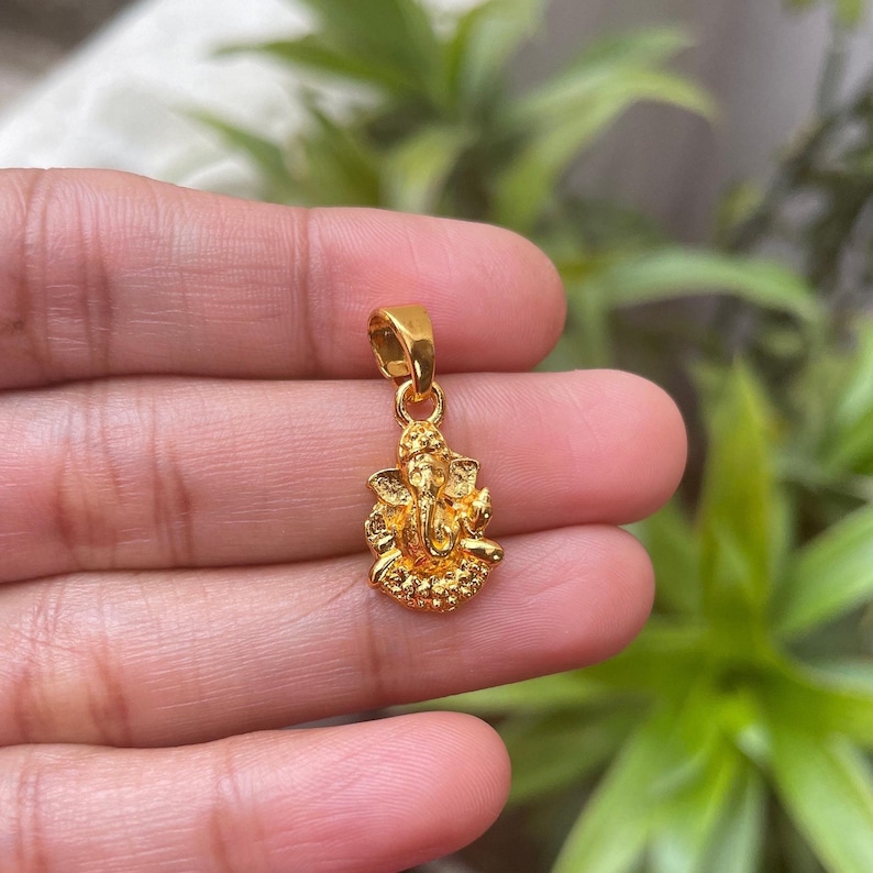 Gift for baby shower
Kids Hindu jewelry
Divine blessing necklace
Ganesha birthday gift
Wealth and success amulet
Prosperity and wisdom pendant
Small Ganpati idol charm
Handmade Hindu pendant
Meditation and yoga charm
Sacred energy necklace
