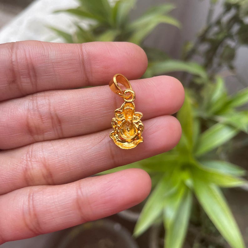 Ganesha good luck charm
Lord Ganesha pendant
Mini Ganesh jewelry
Ganpati pendant for kids
Cute Ganesh locket
Elephant god necklace
Hindu god jewelry
Ganesh birthday gift
Spiritual Ganesha charm
Baby Ganesha necklace