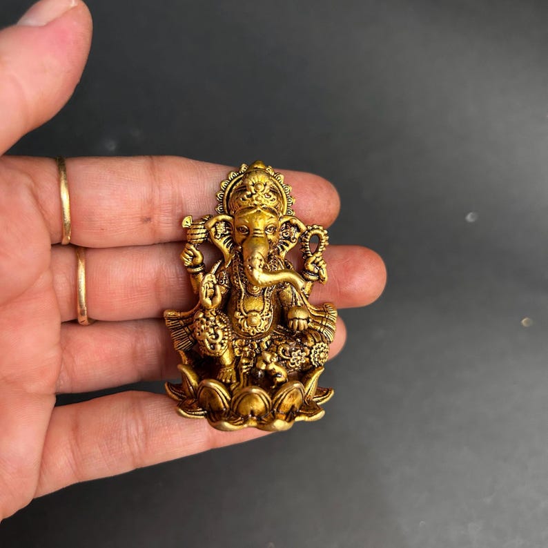 indian puja decor, ganesha brass gift, ganesh ji for home, vastu ganesha statue, ganesha sculpture brass, ganesh chaturthi gift, lucky ganesha idol, ganesha decor for office, ganesha idol corporate gift, divine gift ganpati, puja idol for car, handmade ganesha statue, brass god sculpture, compact ganesha idol, best ganesha for gifting, brass ganesha murti for car, ganesha idol for study table, ganesha idol for work desk, ganesha idol for spiritual decor