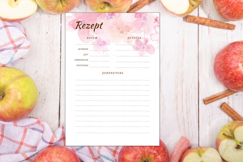 May include: A printable recipe template with a watercolour background featuring pink flowers. The template includes sections for the date, ingredients, and preparation instructions.