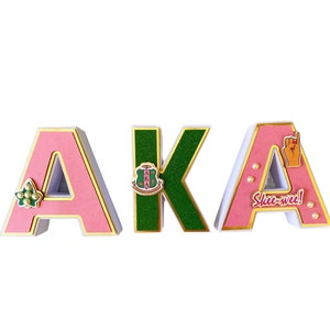 AKA letters-AKA-AKA paraphernalia-aka sorority-aka gifts-aka pinky-pink and green-pretty girls-aka pearls-aka ivy-aka shield-sorority gifts