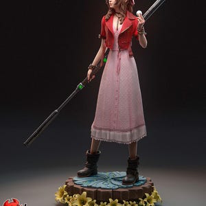 Puede incluir: Figura detallada de una mujer con chaqueta roja y vestido rosa, sosteniendo un bastón y un orbe blanco. La figura se encuentra sobre una base floral con flores amarillas. Objeto de colección.