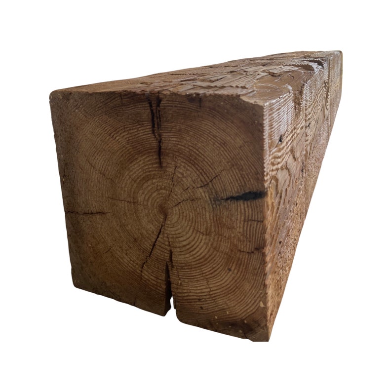 May include: A large, rustic wooden beam with a natural brown finish. The beam has a knot in the center and shows the grain of the wood.