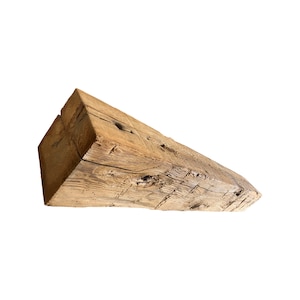 May include: A weathered, rustic wooden beam with a rough, natural texture. The beam is light brown in color and has a rectangular shape.