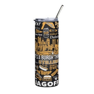 May include: A black and gold stainless steel tumbler featuring a Pittsburgh skyline and various Pittsburgh-themed words and phrases, including "It's a Burgh Thing", "Stillers", "Dubya Dve", "Da'Burg", "Jagoff", and "Hoagie".