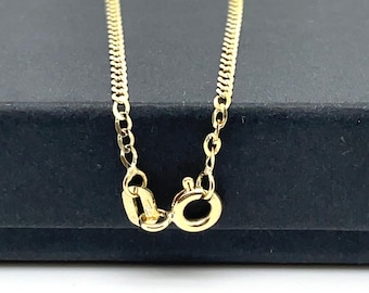 May include: A gold chain necklace with a lobster clasp closure.