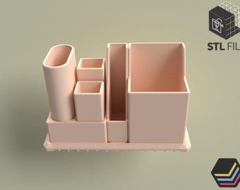 May include: A light pink desk organizer with multiple compartments of varying sizes. The organizer includes a tall cylindrical holder, several square containers, and a larger rectangular section. The words "STL FILE" are visible in the image.