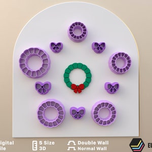 May include: Set of nine purple plastic cookie cutters in the shape of wreaths and bows. The cutters are arranged in a circle on a white background. The cutters are 3D printed and have a double wall.