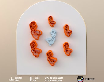 May include: Set of seven orange plastic cookie cutters featuring Olaf and Sven from the movie Frozen. The cutters are arranged in a circle on a white surface.