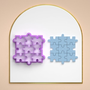 Puede incluir: Dos piezas de rompecabezas, una morada y otra azul, sobre un fondo blanco. La pieza de rompecabezas morada es un recorte, mientras que la pieza de rompecabezas azul es sólida.