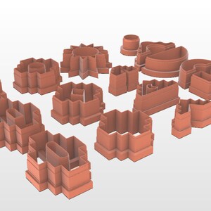 以下が含まれることがあります： 円形、正方形、星形など、さまざまな幾何学的な形をした、テラコッタ色のクッキーカッター14個セットです。