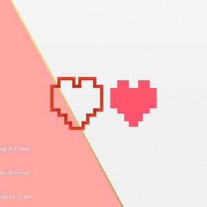 Pode incluir: Duas formas de coração pixeladas, uma vermelha e outra rosa, sobre um fundo branco. O coração vermelho é contornado em preto.