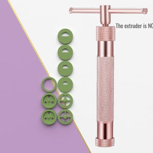 May include: A set of eight green plastic cookie cutters and a rose gold metal cookie press with a handle. The extruder is NOT in the file.