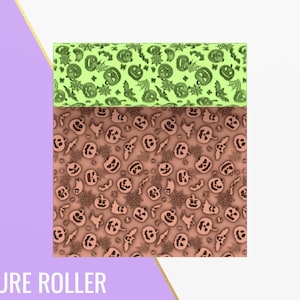 May include: A texture roller with a Halloween theme. The top section is light green with a pattern of pumpkins, bats, and spiderwebs. The bottom section is a reddish-brown with a similar pattern. The text "TEXTURE ROLLER" is at the bottom.