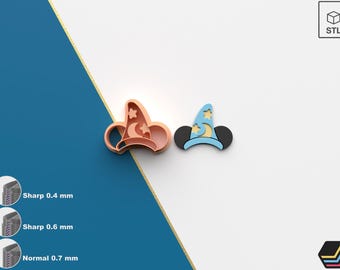May include: Two 3D printed cookie cutters, one in light blue and one in peach, shaped like Mickey Mouse ears with a wizard hat on top. The hat has a crescent moon and stars on it. The cutters are on a white background.