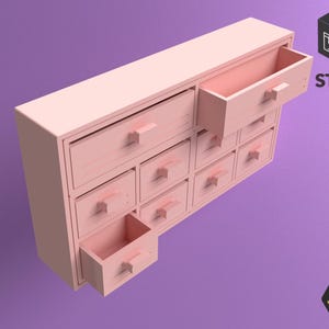 Puede incluir: Un mueble de madera rosa claro con varios cajones, algunos abiertos. El mueble tiene forma rectangular y está sobre un fondo morado. El texto "STL FILE" es visible en la esquina superior derecha.