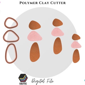 Puede incluir: Un archivo digital para un juego de cortadores de arcilla polimérica. El juego incluye tres formas diferentes: un óvalo grande, un óvalo más pequeño y una forma de lágrima. Las formas están en tonos de marrón y rosa.