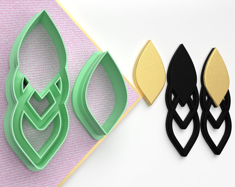 May include: A set of three green plastic cookie cutters shaped like a leaf. The cutters are shown next to two pairs of earrings, one pair is black and the other is gold.
