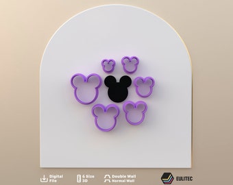 May include: A collection of purple and black Mickey Mouse-shaped cookie cutters in various sizes. The cutters are arranged on a white surface, with a light beige background. The image also includes text indicating the product is a digital file.