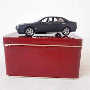 Dark gray Alfa Romeo With red advertising box, collectible cars