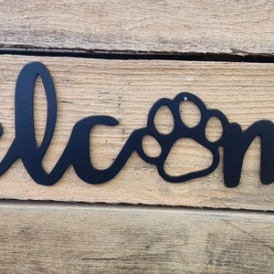 Welcome sign with dog paw