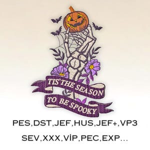 May include: An embroidered patch with a skeleton hand holding a jack-o'-lantern. The patch has a purple ribbon with the text "Tis the season to be spooky".