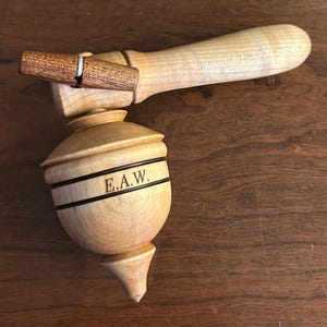 Wooden spinning toy top with handle
