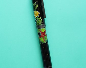 サンゴ礁をテーマにした手描きの黒エボナイト製ナバルール ノーチラス万年筆 ピストンフィラー #6 ペン先