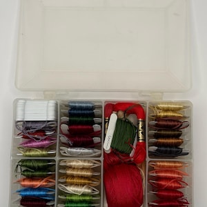 Assorted various colors of crewel thread with container