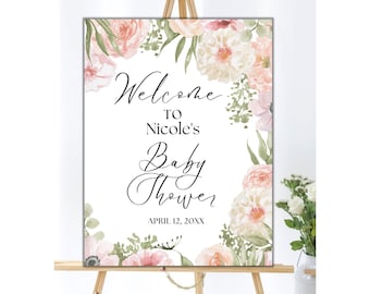 May include: A white welcome sign with pink and green floral watercolor designs. The text reads "Welcome to Nicole's Baby Shower April 12, 20XX".