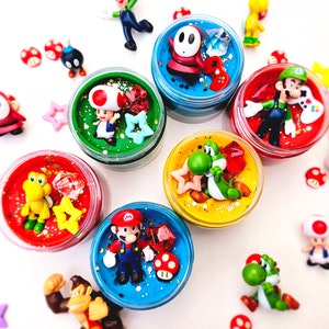 homemade playdough jar with video game character figure and sensory pieces